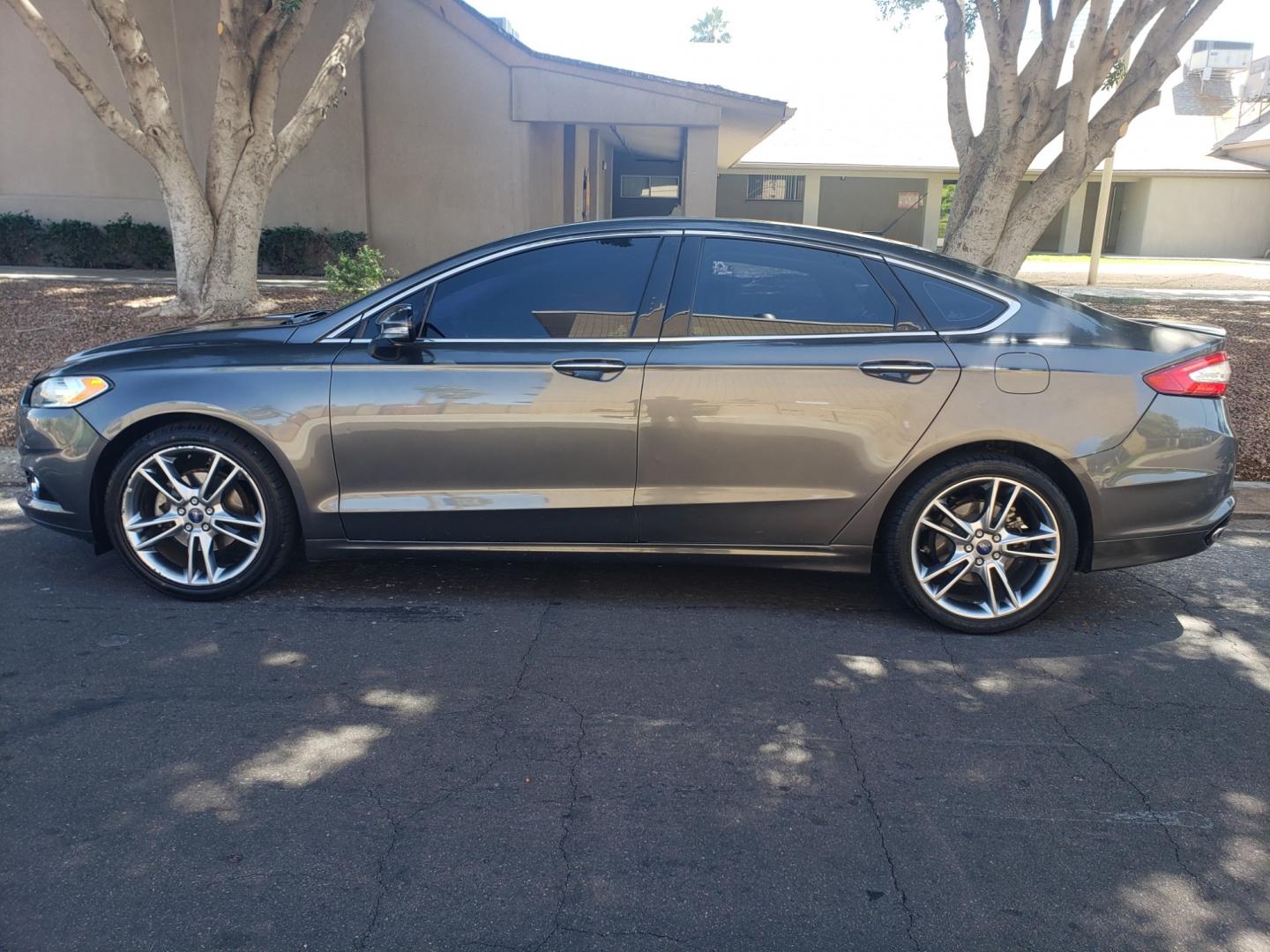 2016 /gray and black Ford Fusion titanium (3FA6P0K99GR) with an 2.0L L4 DOHC 16V engine, 4-Speed Automatic transmission, located at 323 E Dunlap Ave., Phoenix, AZ, 85020, (602) 331-9000, 33.567677, -112.069000 - 2016 Ford Fusion Titanium,......EXCELLENT condition, A Real Must See!!....ONLY 118K MILES,...... No accidents, Power everything, Touch screen Stereo/cd player, Phone sync, Bluetooth, Satellite compatible, Buckup camera, Navigation, Ice cold ac, Clean gray and Black interior with black leather seats - Photo#6